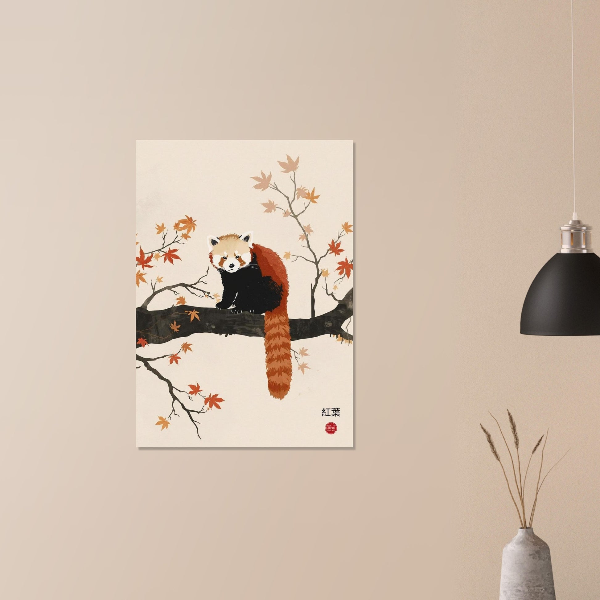 Framed artwork of a red panda on a branch with autumn leaves on a beige wall.