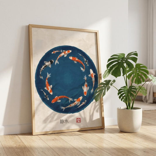 Japanese koi fish circle poster displayed on a wooden floor leaning against a wall with a green plant in a modern interior