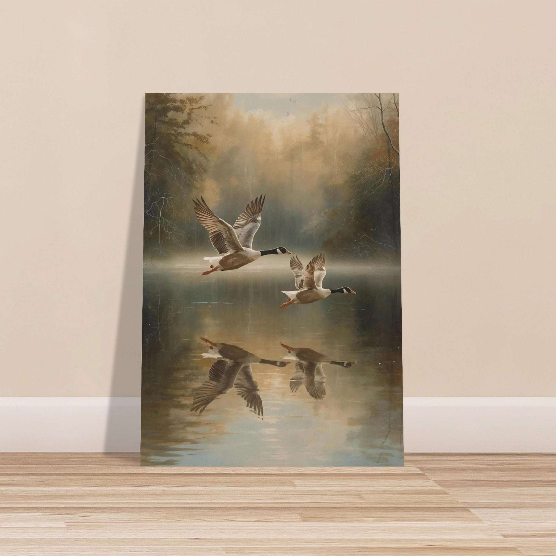 Framed artwork of geese flying over water on a wall.