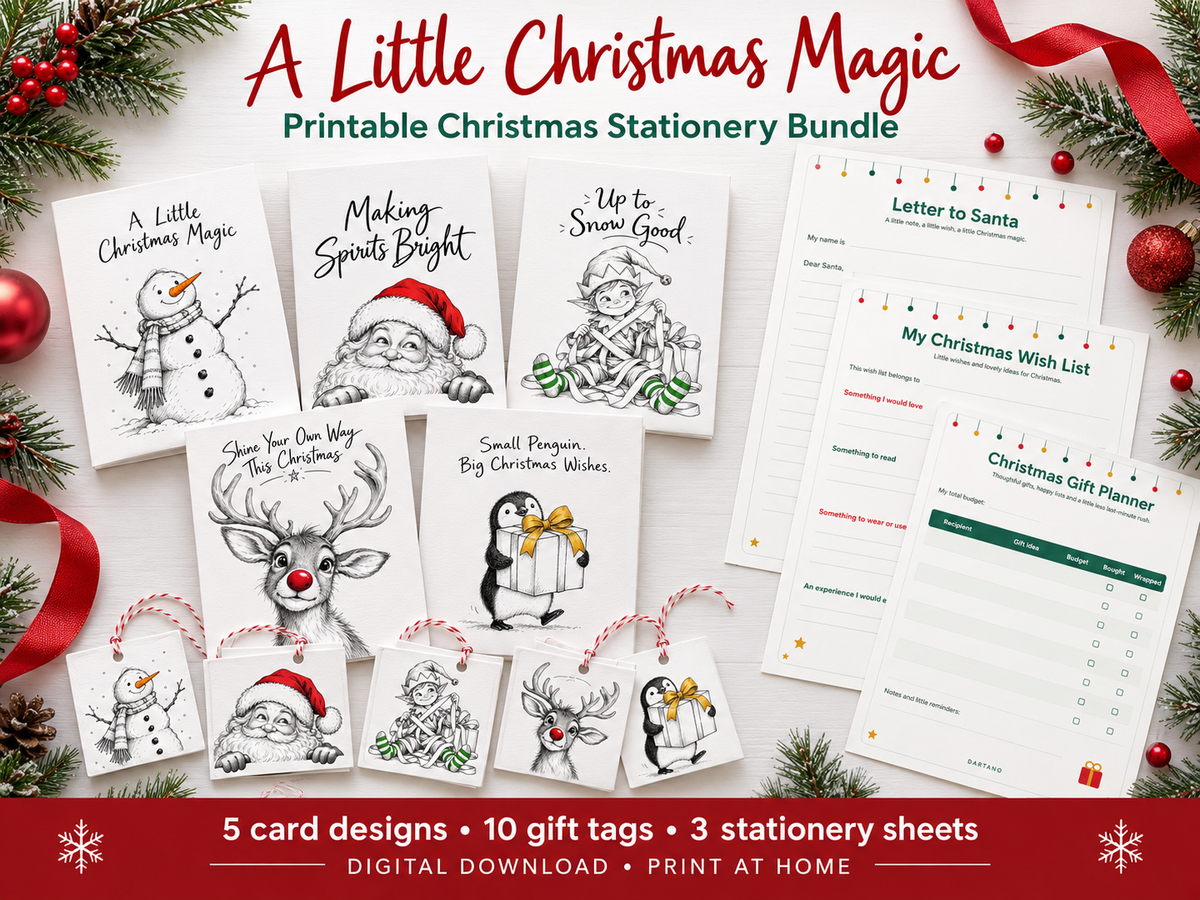 A festive flat lay of a printable Christmas stationery bundle titled 'A Little Christmas Magic.' The image shows several black-and-white holiday card designs with Christmas illustrations, printable gift tags, and stationery sheets, arranged with pine branches, red ornaments, and ribbons.