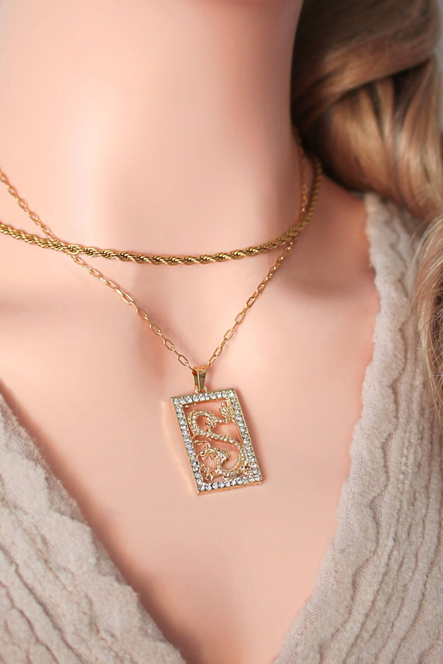 Necklace with a decorative pendant worn by a person