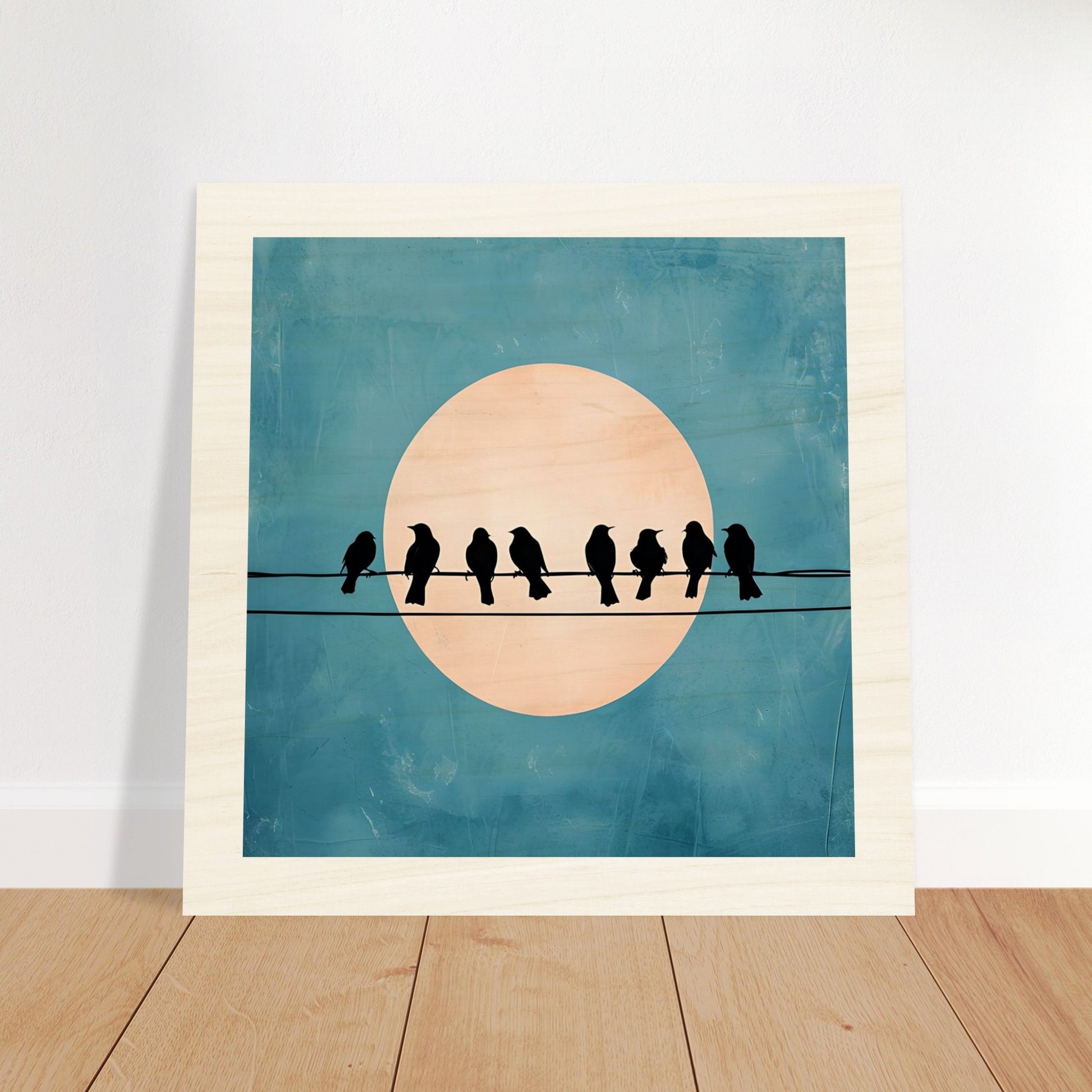 Wooden artwork of birds on a wire with a moon in the background