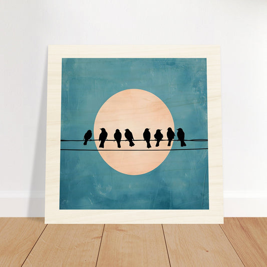 Wooden artwork of birds on a wire with a moon in the background