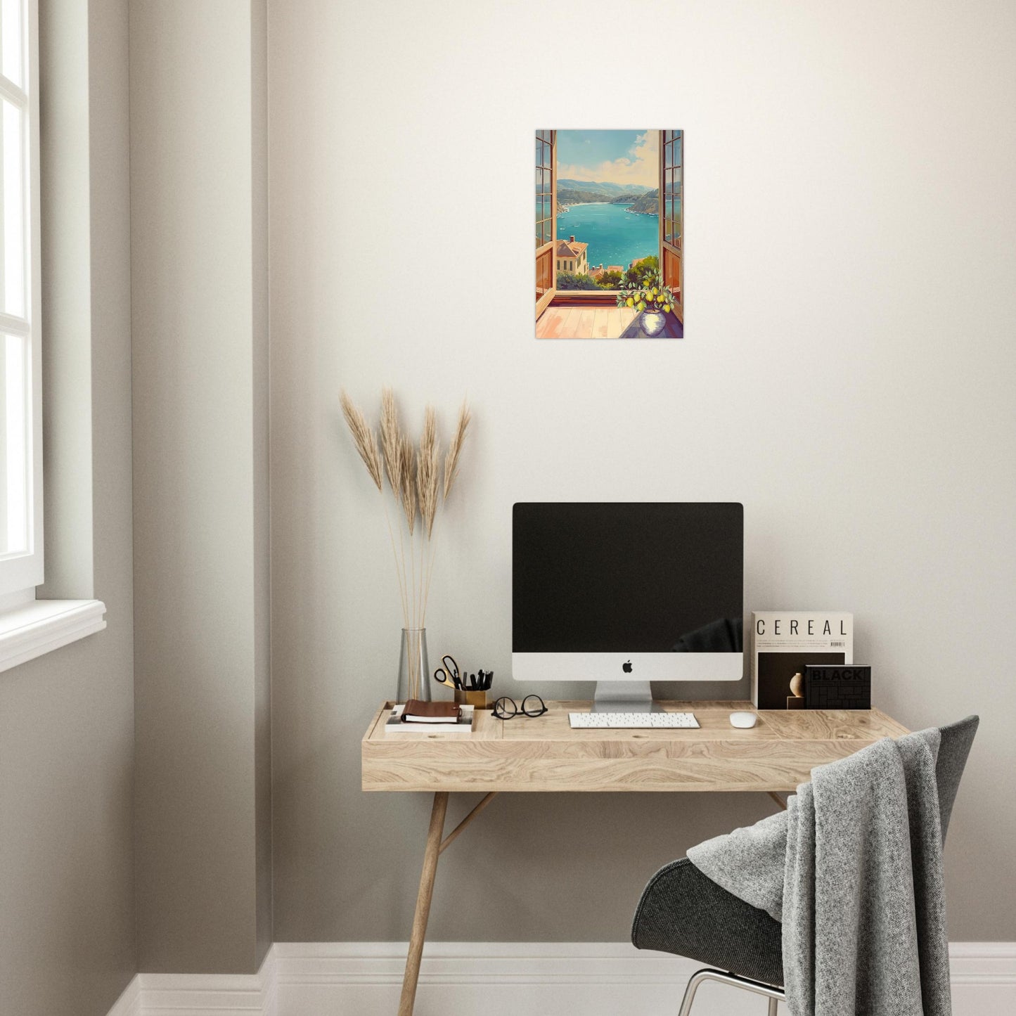 Modern home office with a desk, computer monitor, and decorative elements.