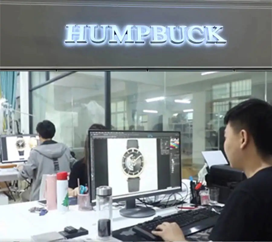 Person working on a computer with 'HUMPBUCK' branding in the background