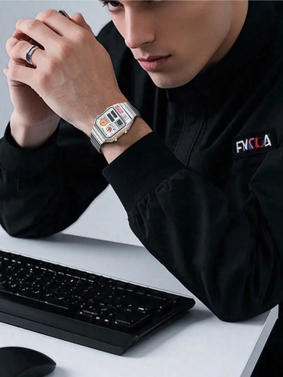 Person wearing a futuristic watch at a desk with a keyboard