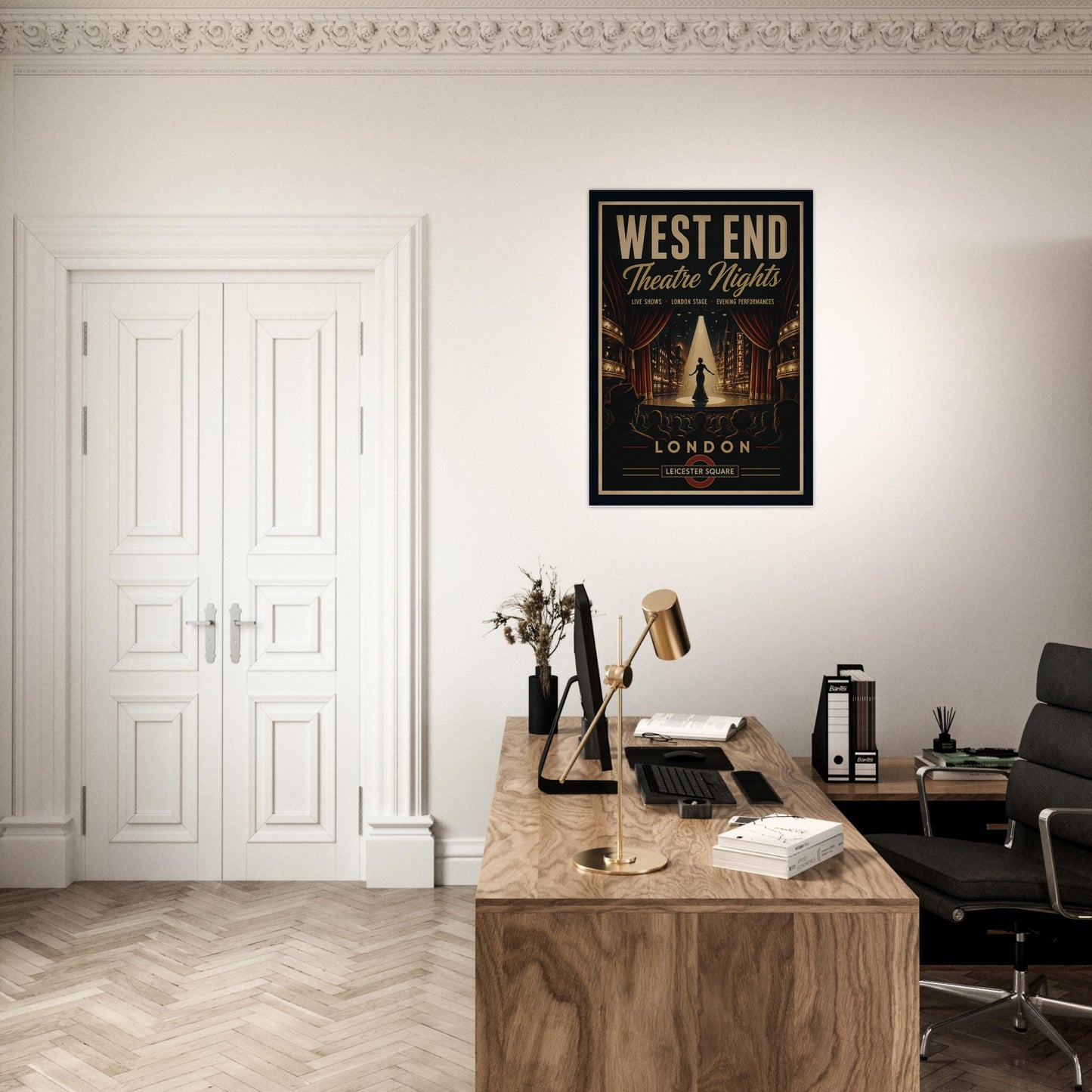Modern office with a framed poster of 'West End Theatre Nights, London' on the wall.