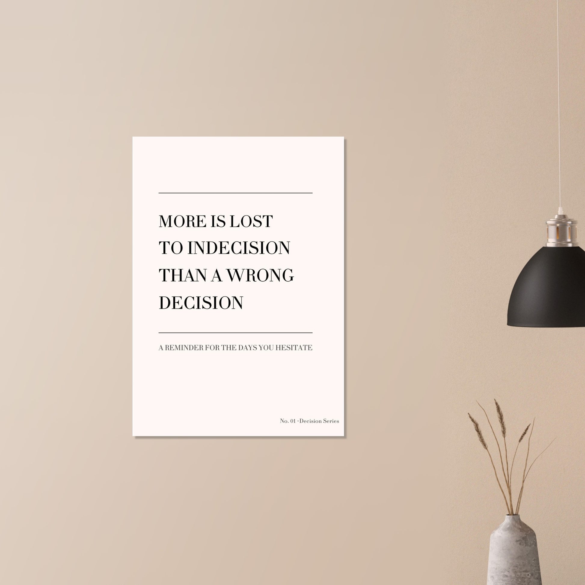 Poster with motivational quote on a beige wall with a black lamp and vase.