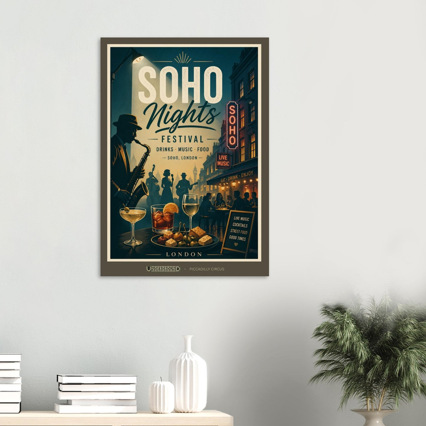 Framed poster for 'Soho Nights Festival' on a wall with decor items below.