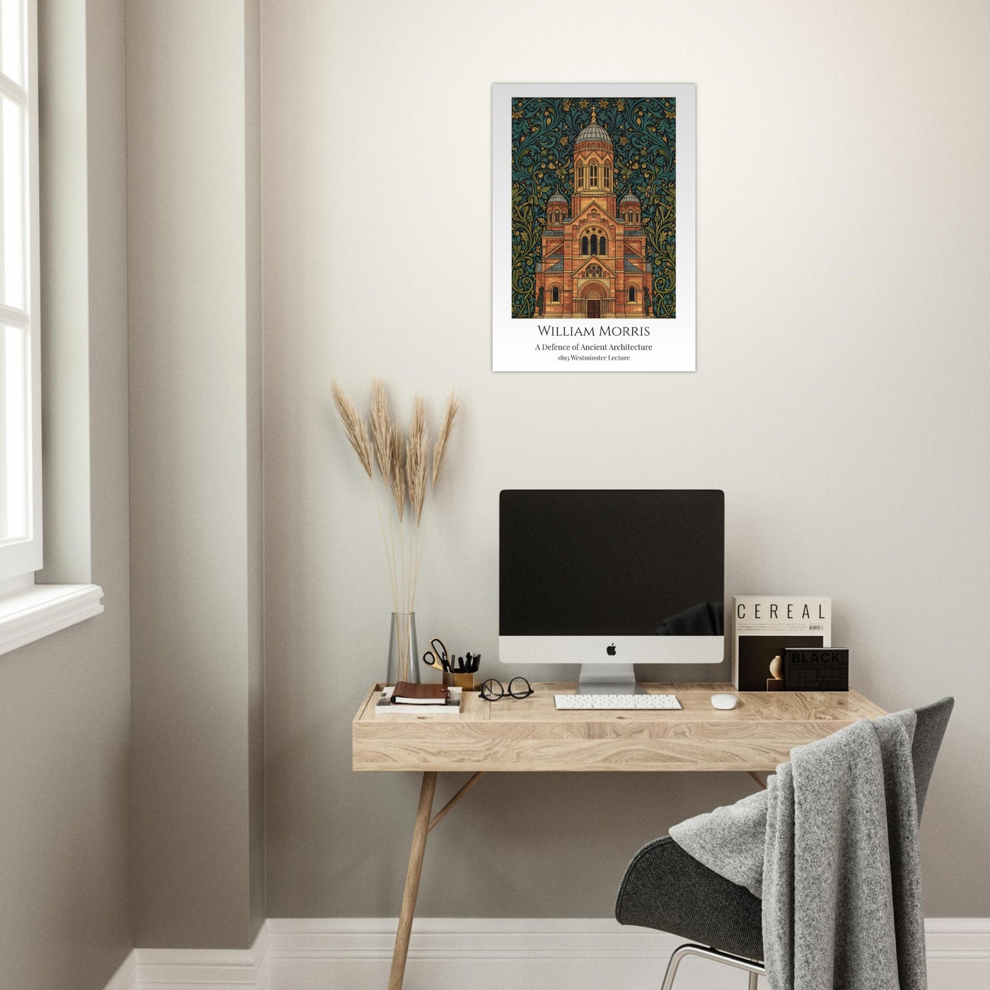 Modern home office with a desk, computer, and framed William Morris artwork on the wall.