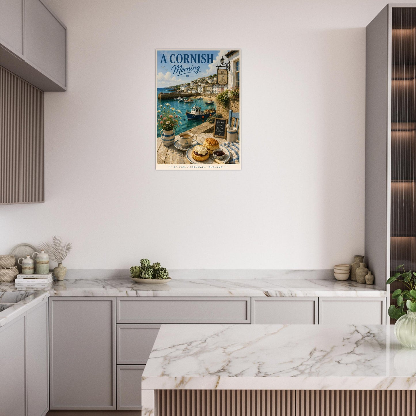 Kitchen with a framed picture of a Cornish seaside scene on the wall.