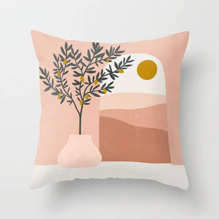 Decorative pillow with a vase and leaves design on a pink background