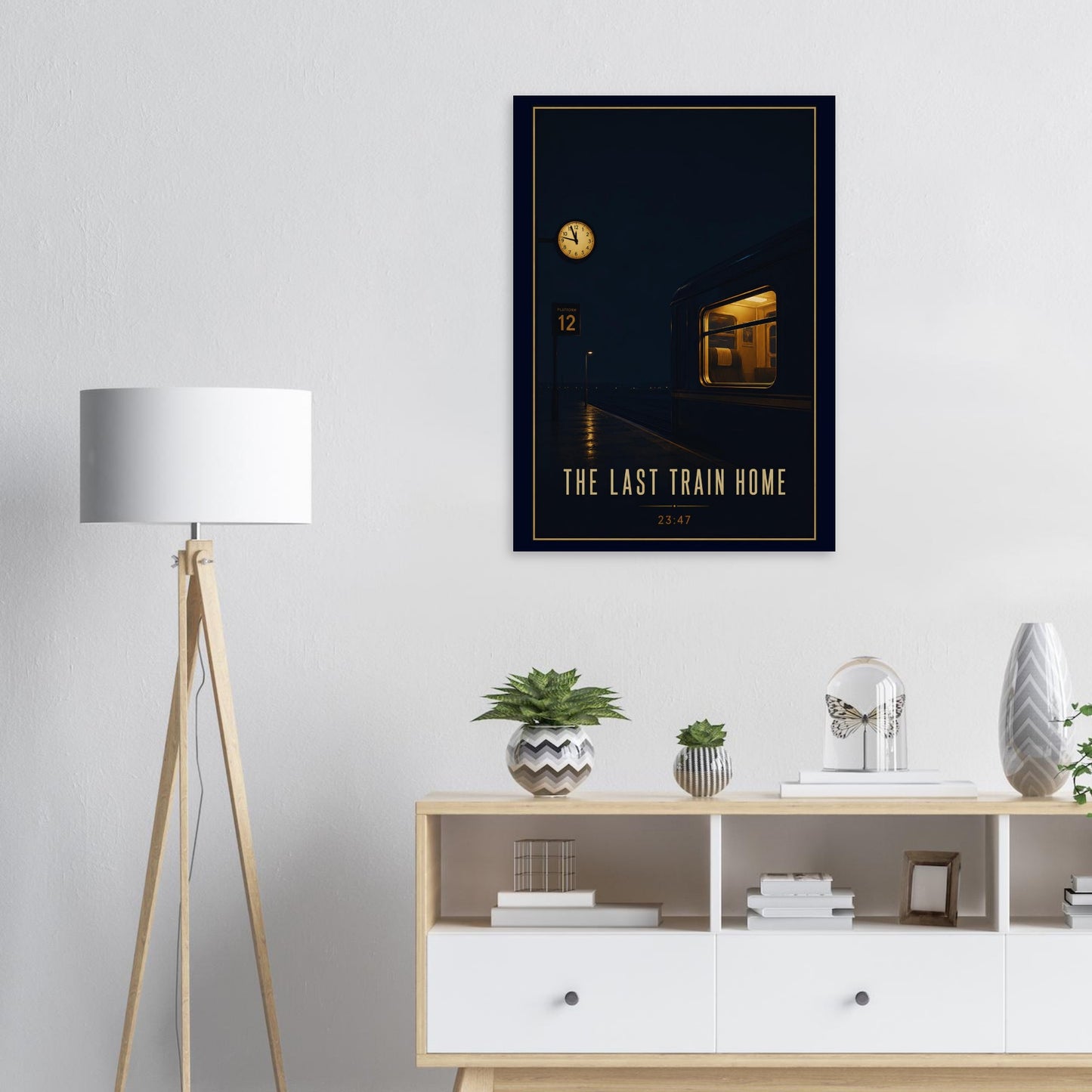 Framed artwork titled 'The Last Train Home' on a wall above a wooden sideboard with decorative items.