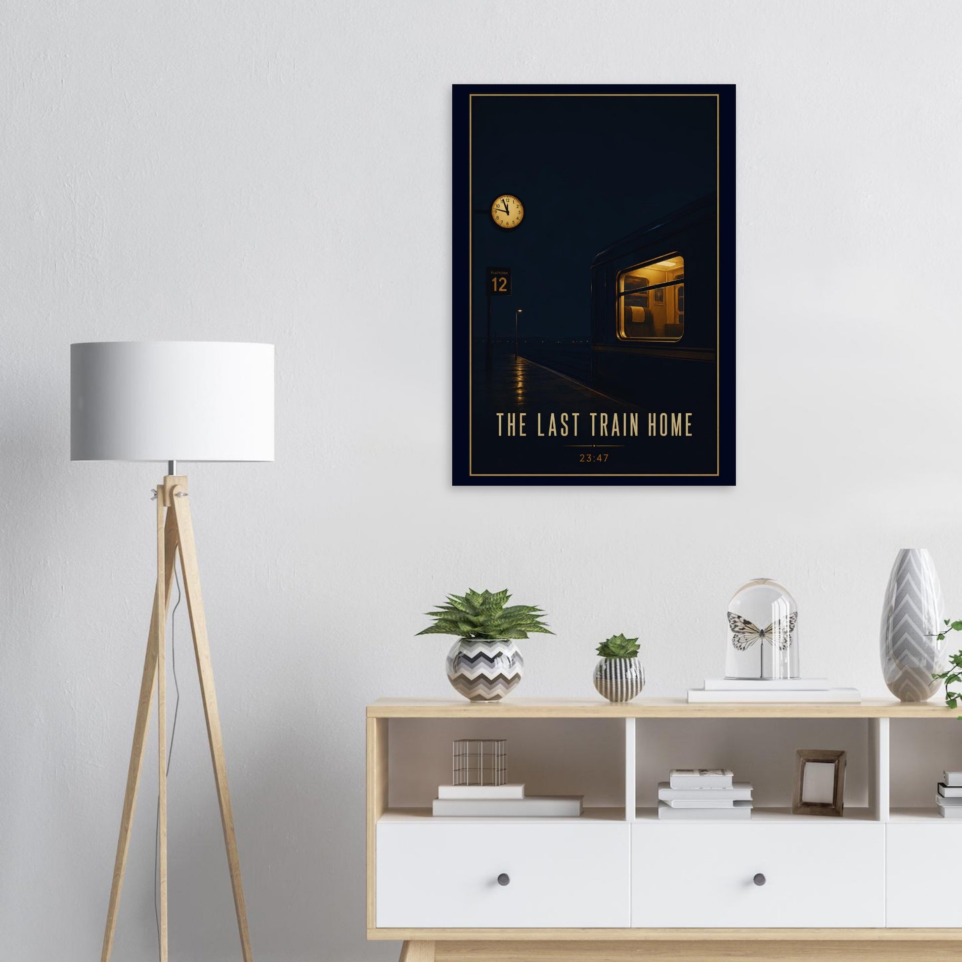 Framed artwork titled 'The Last Train Home' on a wall above a wooden sideboard with decorative items.