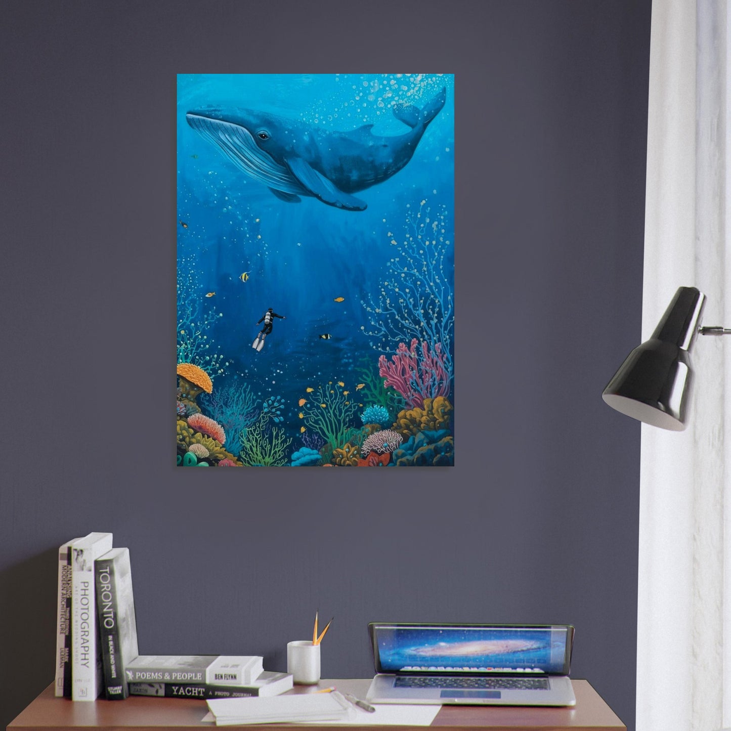 Underwater scene with a whale and diver on a wall above a desk.