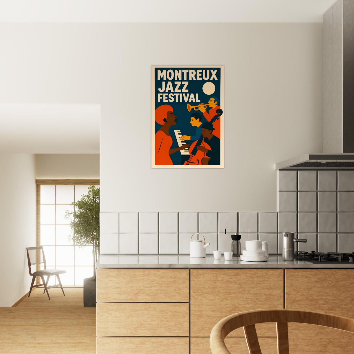 A framed poster featuring the Montreux Jazz Festival in a stylized orange, navy, and cream graphic design, displayed on a light beige wall in a modern kitchen setting.