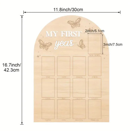 Wooden baby milestone board with measurements on a white background