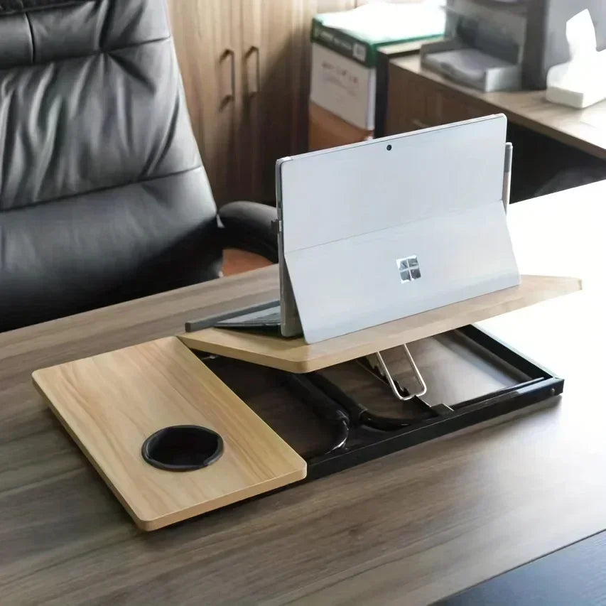 Laptop on a wooden stand with a cup holder on a desk