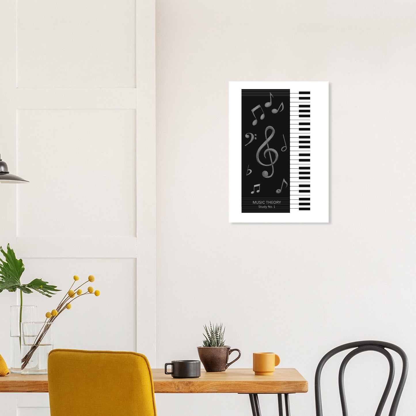 Framed artwork with musical notes and piano keys on a wall above a table with decor items.