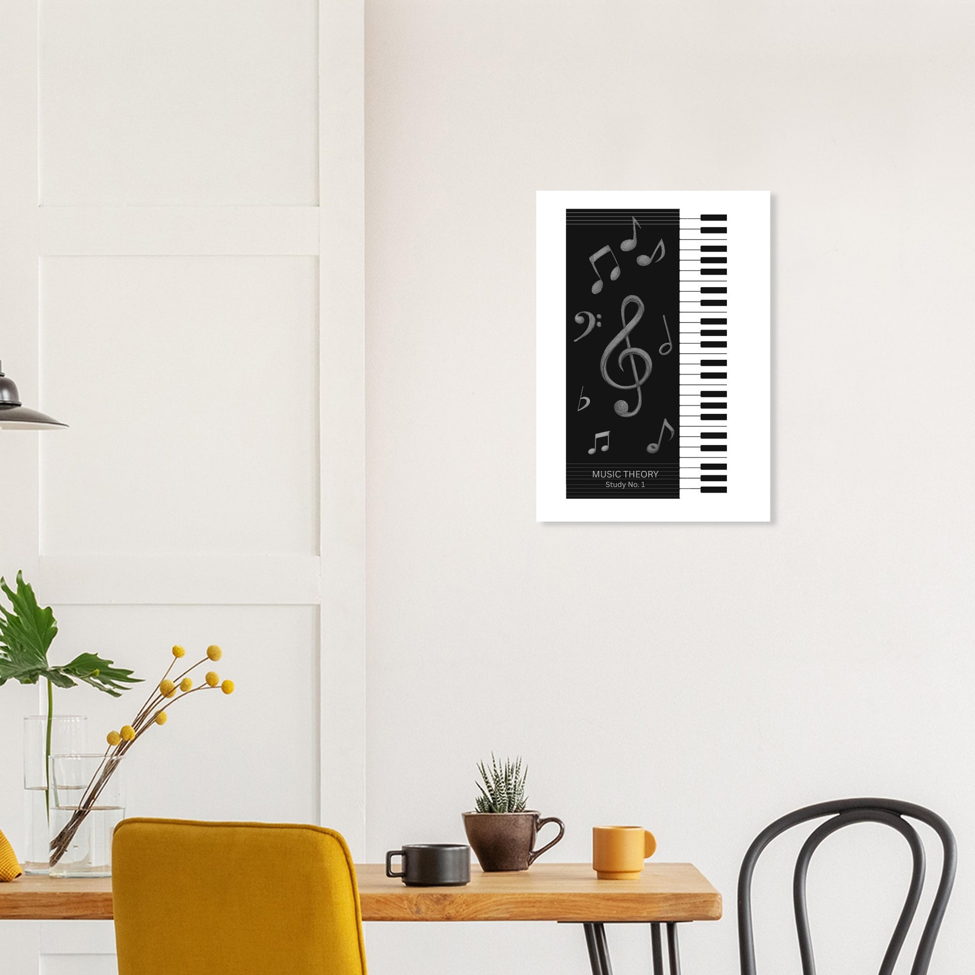 Framed artwork with musical notes and piano keys on a wall above a table with decor items.