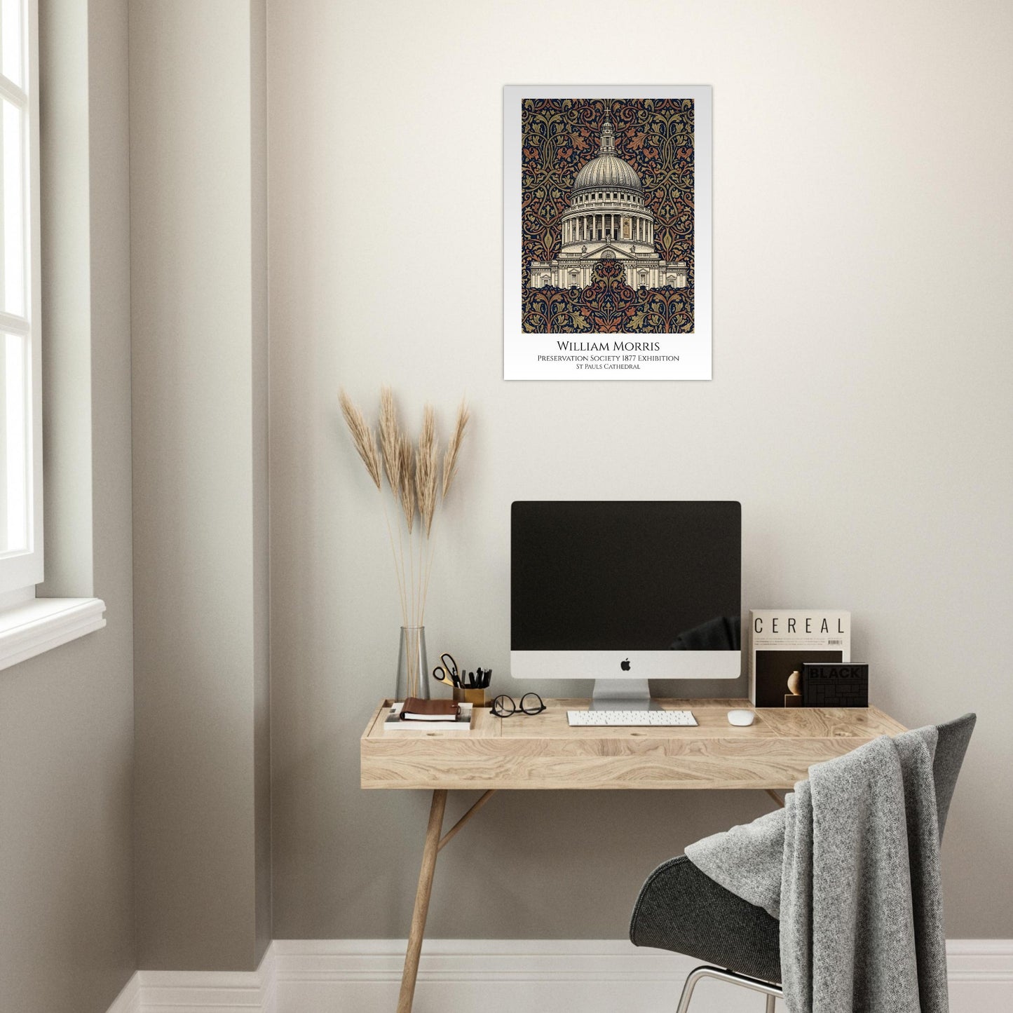 Modern home office with a desk, computer monitor, and framed artwork on the wall.