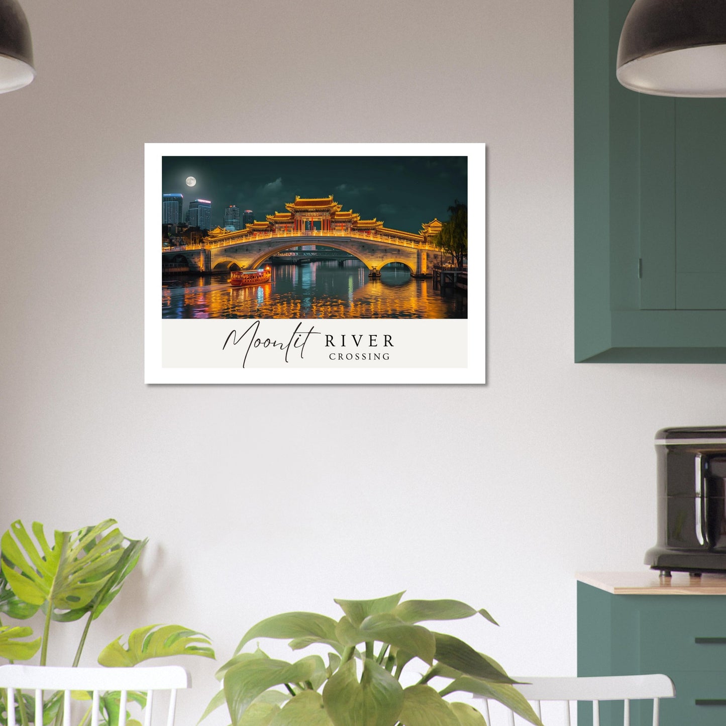 Framed artwork of a bridge over a river with 'Moonlit River Crossing' text, displayed on a wall in a room with plants and furniture.