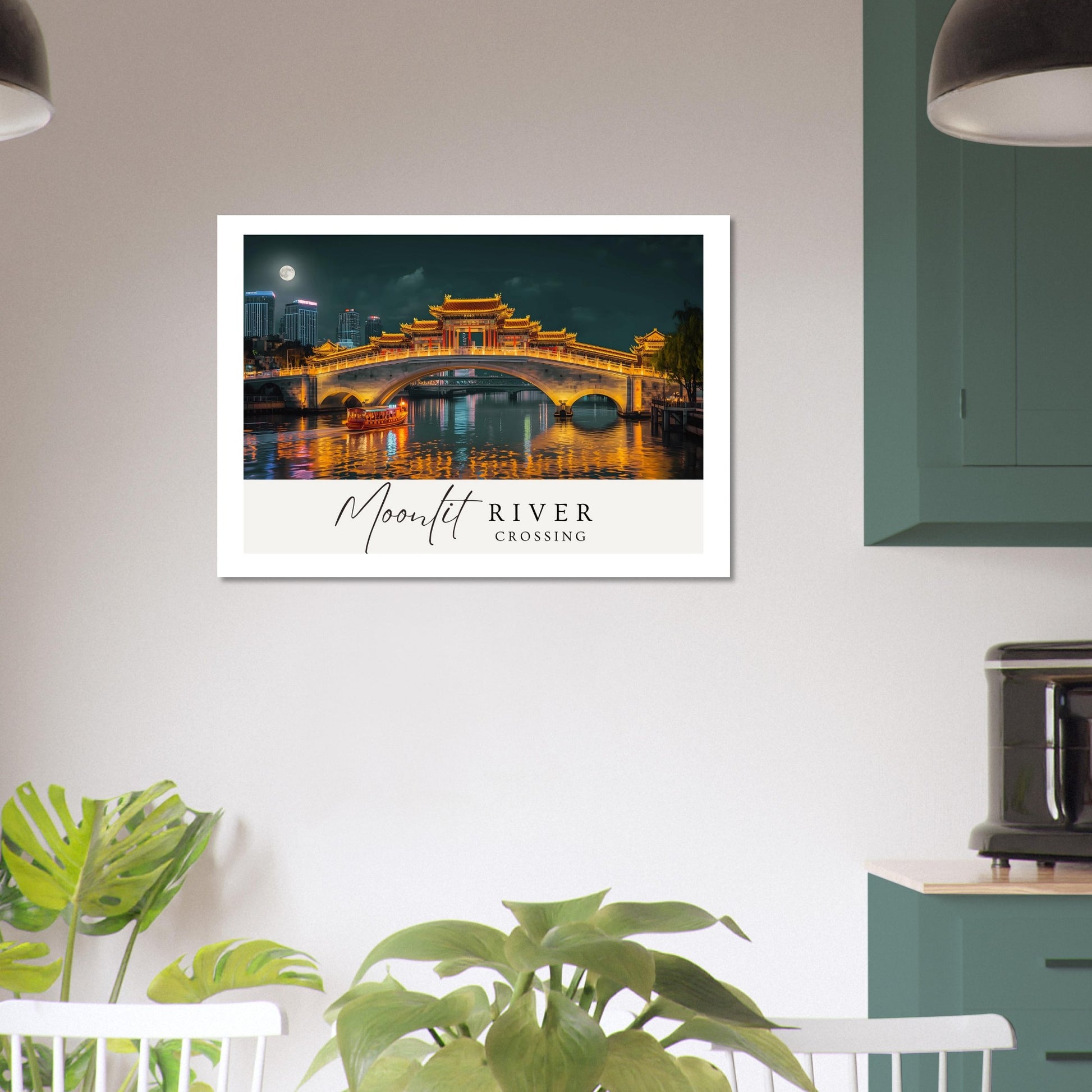 Framed artwork of a bridge over a river with 'Moonlit River Crossing' text, displayed on a wall in a room with plants and furniture.