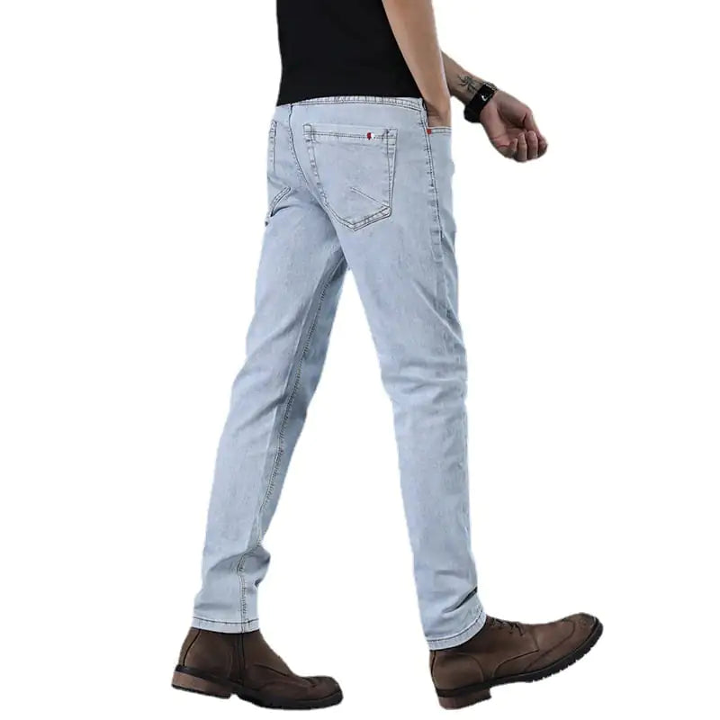 Light blue jeans worn by a person on a white background