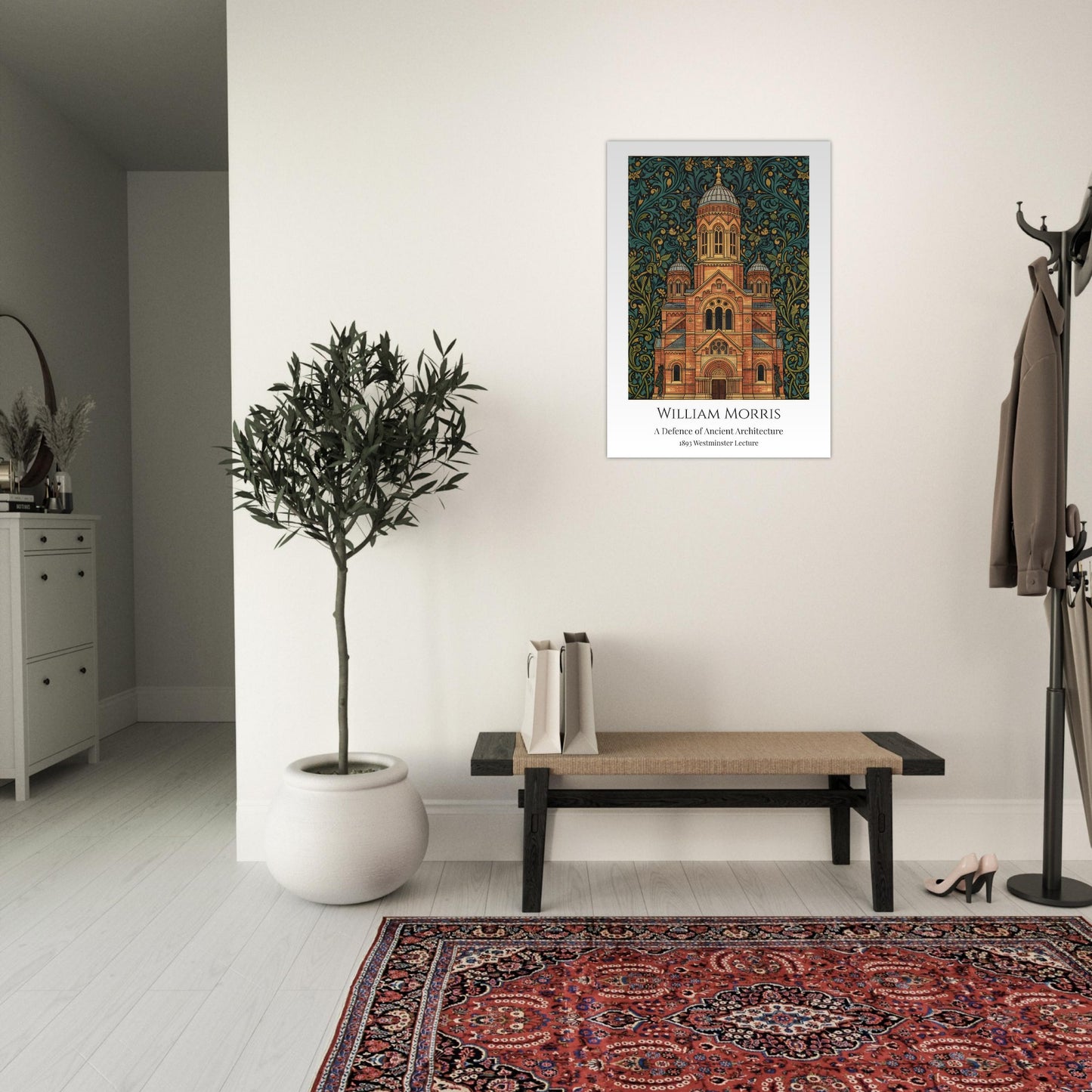 Framed William Morris artwork of a building on a wall in a room with a plant, bench, and rug.