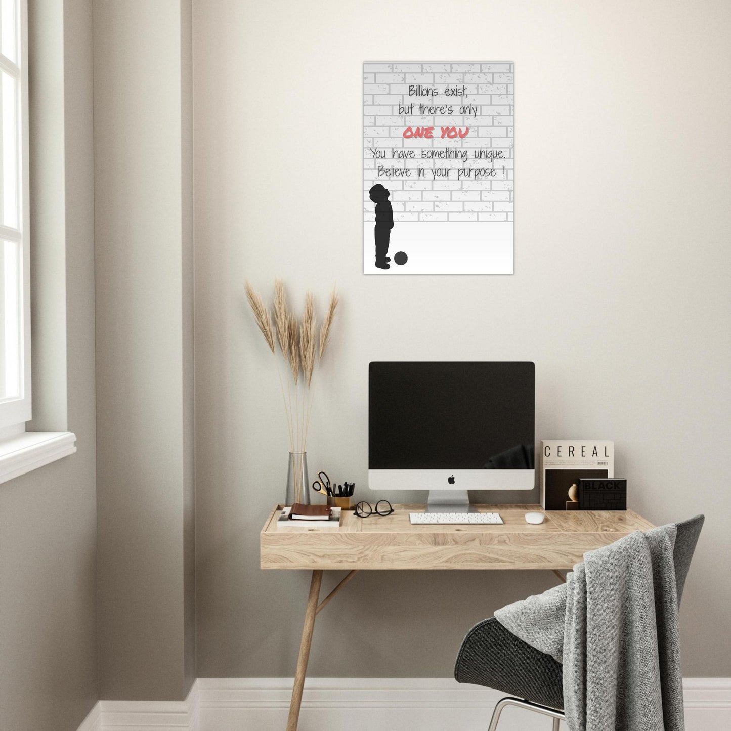 Modern home office with a desk, computer, and motivational poster on the wall.