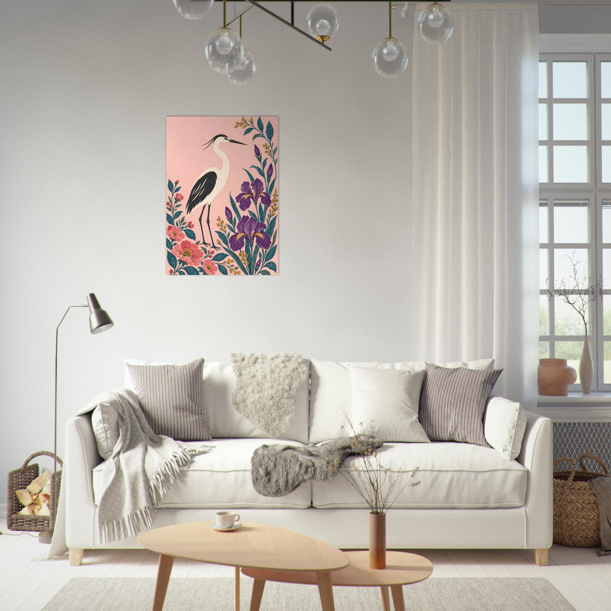 A vertical canvas art print featuring a pink heron and colorful flowers, displayed on a white wall above a modern white sofa in a bright, contemporary living room.