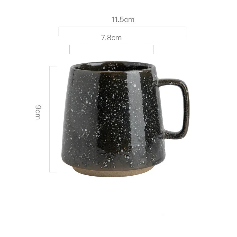 Black speckled mug with dimensions on a white background
