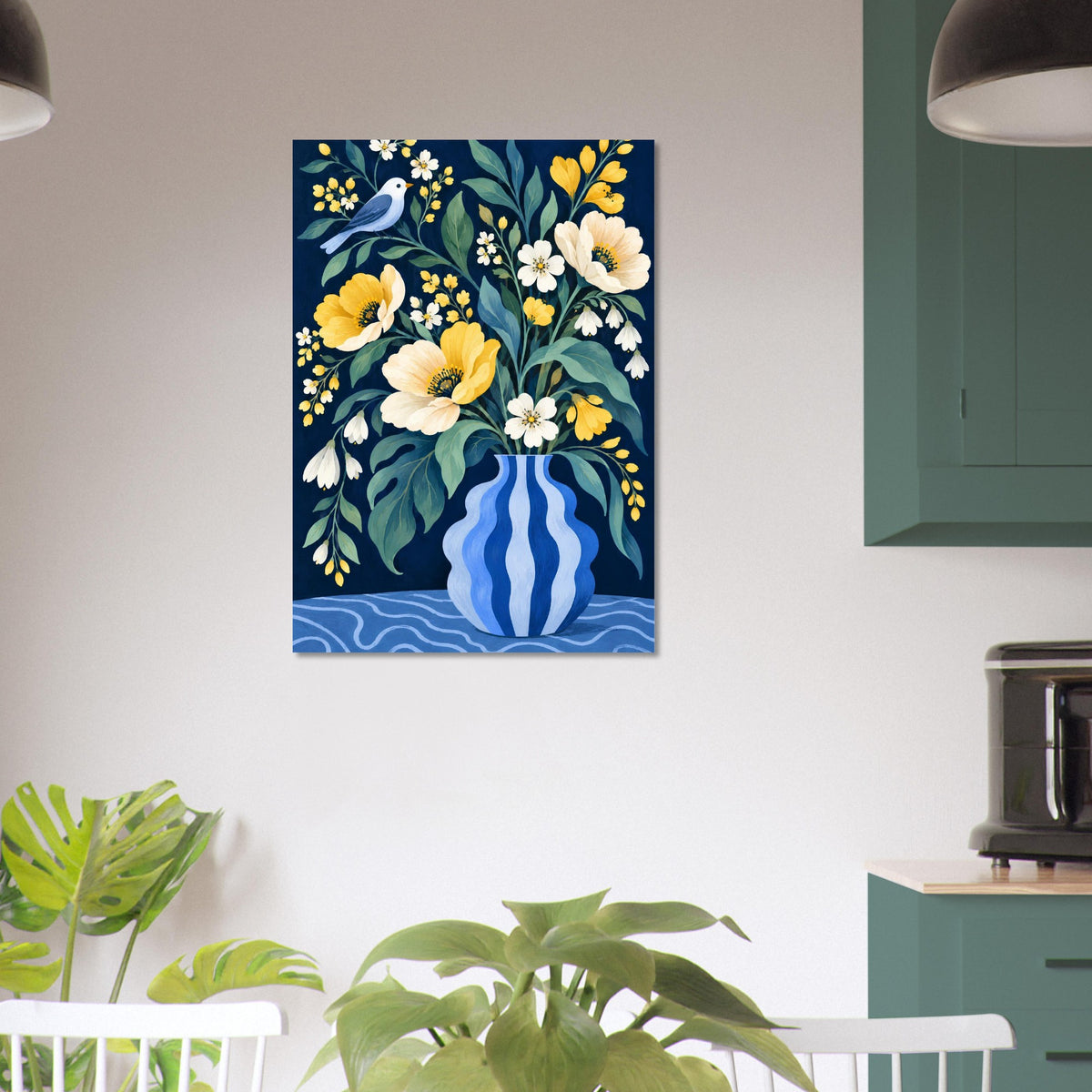 A vertical canvas wall art print featuring a floral bouquet in a blue striped vase, displayed on a white wall in a modern kitchen setting with green cabinets and plants.