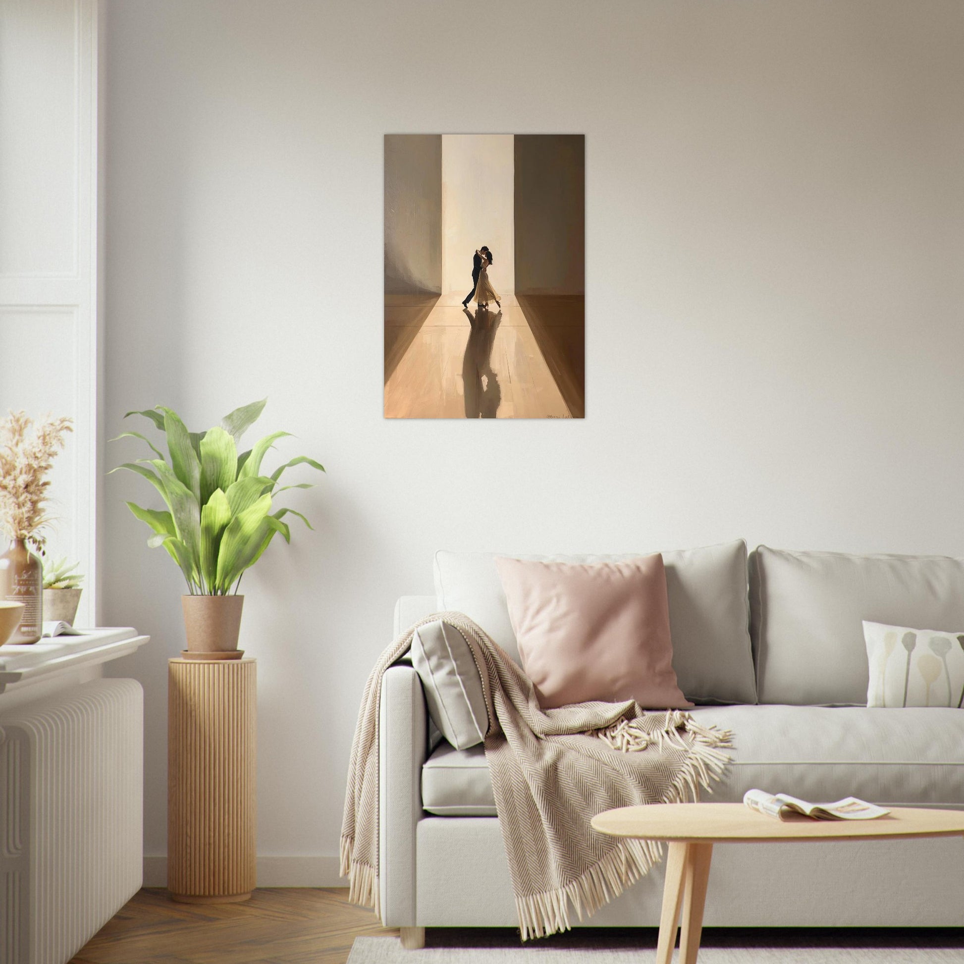 Living room with a sofa, coffee table, and decorative items including a plant and a painting.