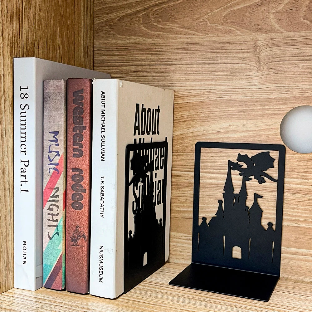 Black castle-shaped bookend on a wooden shelf with books