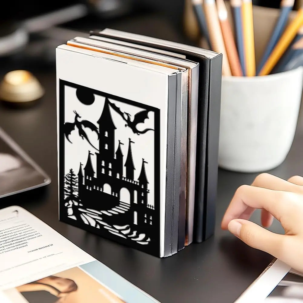 Decorative bookends with a castle design on a desk