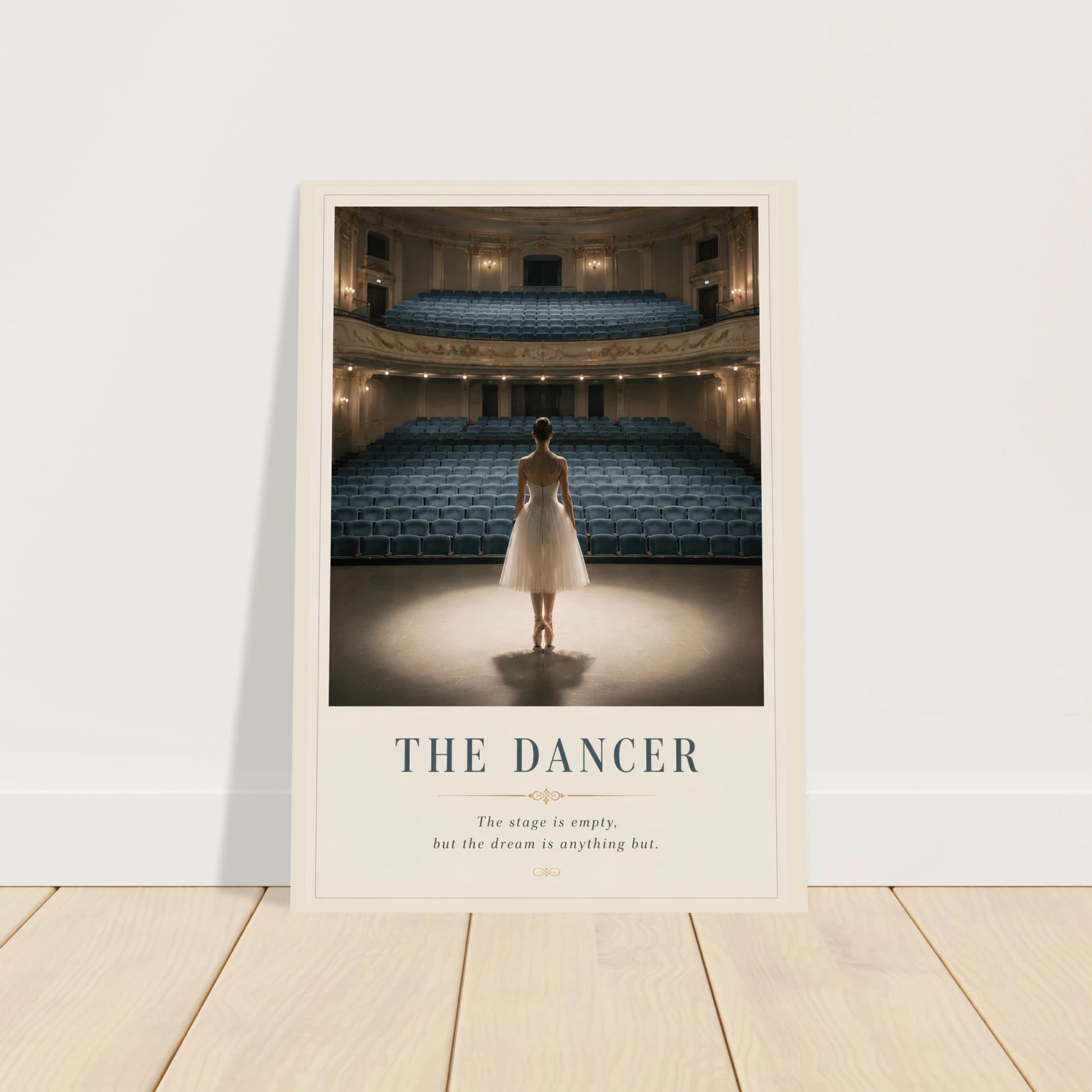 Framed poster of a dancer in an empty theater with text 'The Dancer' on a white wall.