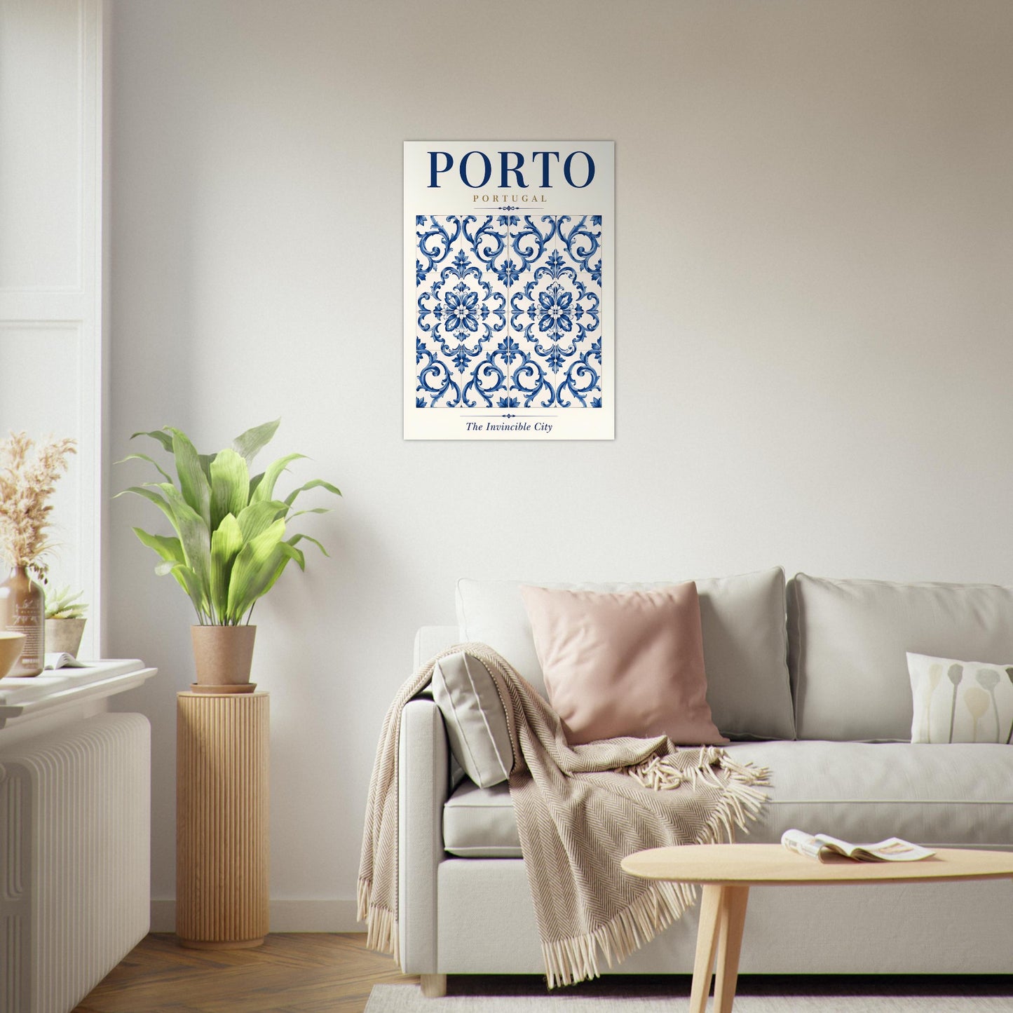 Porto blue and white tile wall art displayed above a sofa in a bright neutral living room.