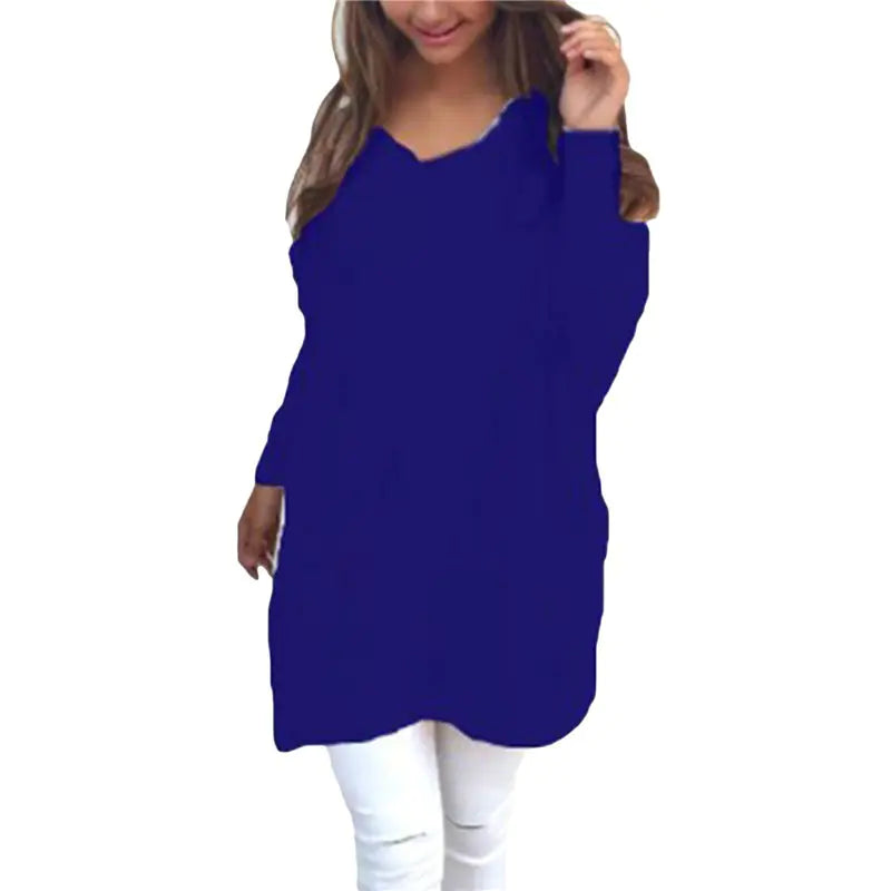 Blue long-sleeve top worn by a person on a white background