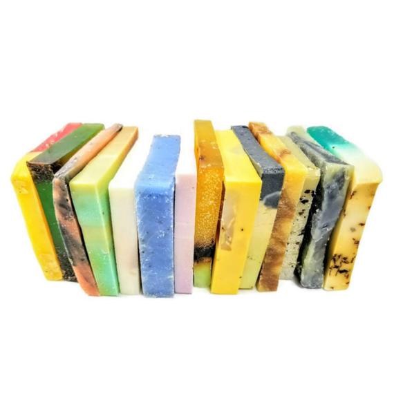 Vegan soap sampler with 8 colorful natural soap slices tied with a ribbon, arranged on a white background