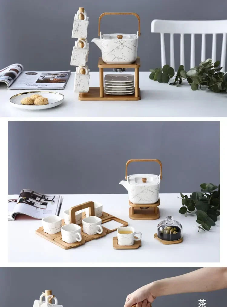 Tea set with teapot, cups, and coasters on a white surface with a gray background.