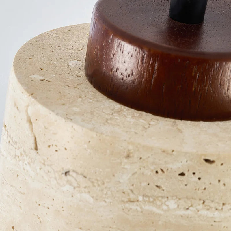 Close-up of a wooden base on a stone-like surface