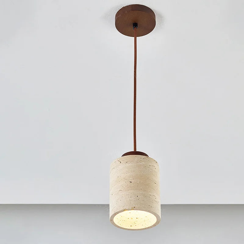 Cylindrical pendant light with a textured shade and bronze fixture on a plain background