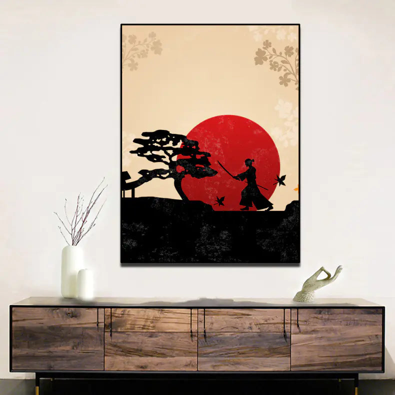 Framed artwork of a silhouette against a red sun on a beige background, displayed above a wooden cabinet.