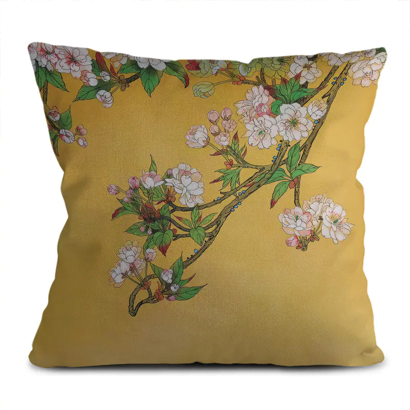 Decorative pillow with floral design on a yellow background