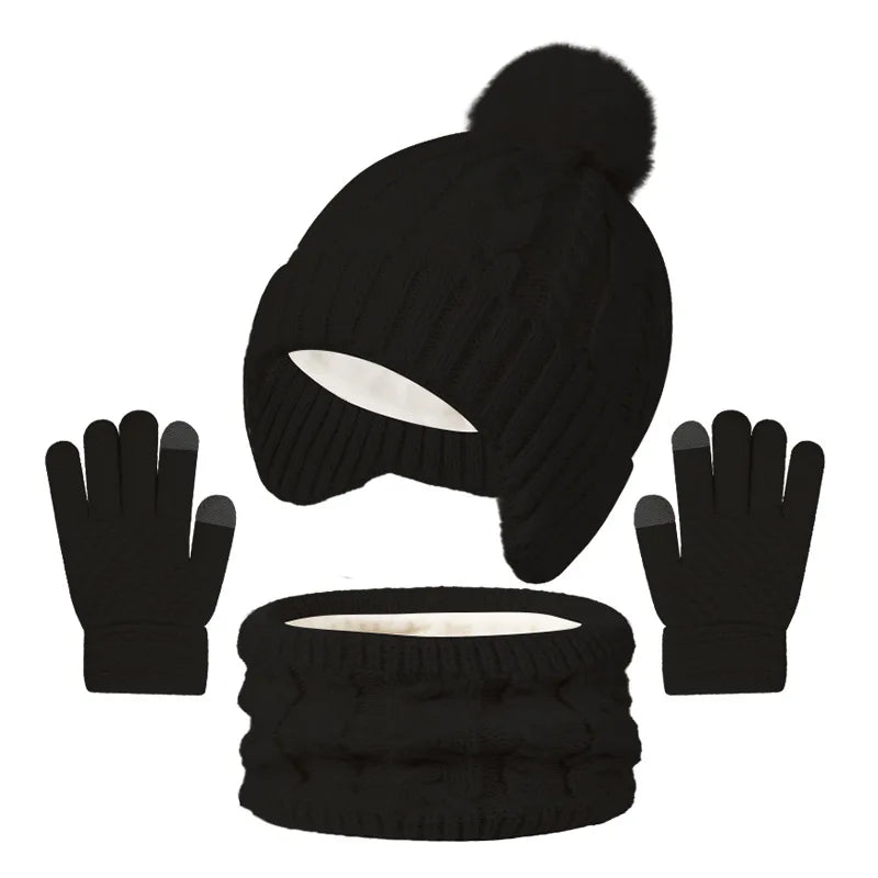 Black knit beanie with pom-pom, black gloves, and black knit scarf on a white background