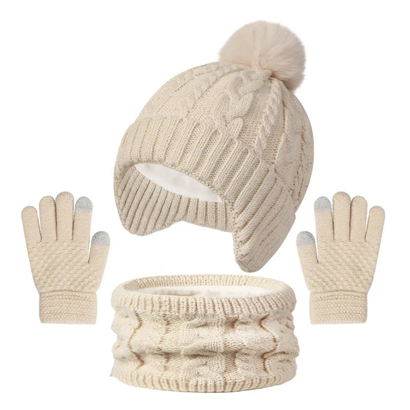 Beige knit hat with pom-pom, matching gloves, and scarf on a white background