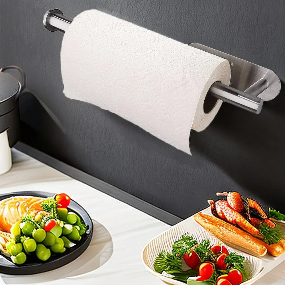 Roll of paper towel on a magnetic strip above a kitchen counter with food.