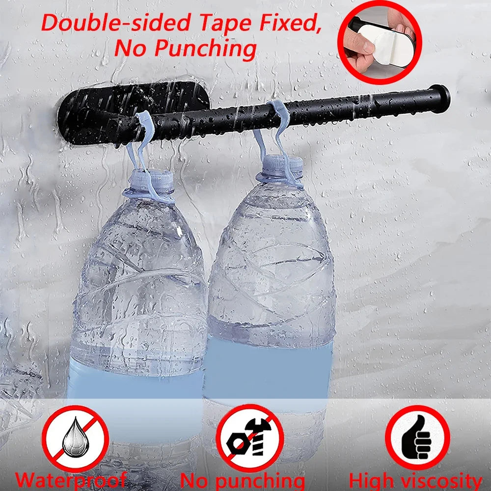 Black double-sided tape used to hang two water bottles on a textured wall with text highlighting features.