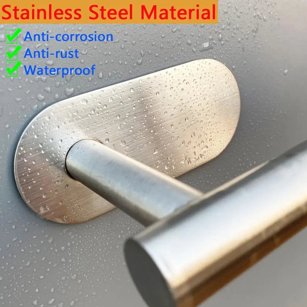 Stainless steel door handle on a metallic surface with text highlighting material properties.